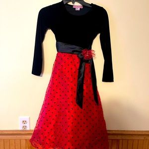 Girls size 8, “lady bug-look” dress. Adorned w/Black sash & red flower